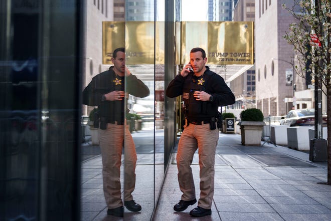 A member of the U.S. Secret Service stands watch outside Trump Tower on Fifth Avenue April 3, 2023 in New York City. Former President Donald Trump is scheduled to travel to New York City today with an expected arraignment tomorrow at a Manhattan courthouse following his indictment by a grand jury.