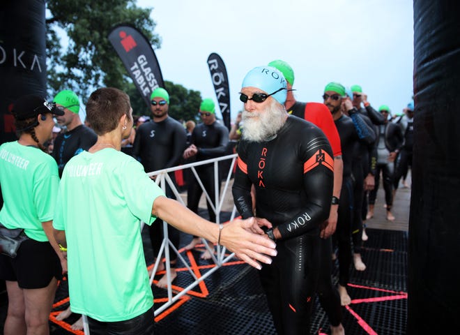 A competitor is ready to swim during the Ironman North American Championship 140.6-mile Des Moines Triathlon as athletes compete in a 2.4-mile swim at Gray’s Lake, 112-mile bike race, and a 26.2-mile run in Des Moines on Sunday, June 12, 2022. This regional competition will offer qualifying slots to the 2022 Ironman World Championship in Kailua-Kona, Hawaii in early October 2022.