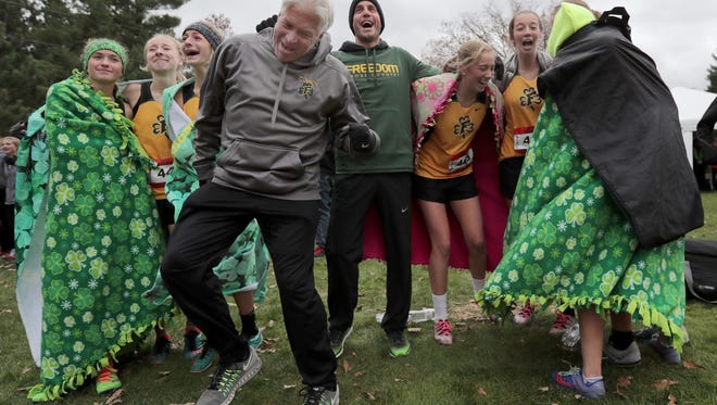 Freedom coach Thain Jones celebrates with the team after winning the Division 2 state team championship at The Ridges Golf Course in Wisconsin Rapids on Saturday. Wm. Glasheen/USA TODAY NETWORK-Wisconsin