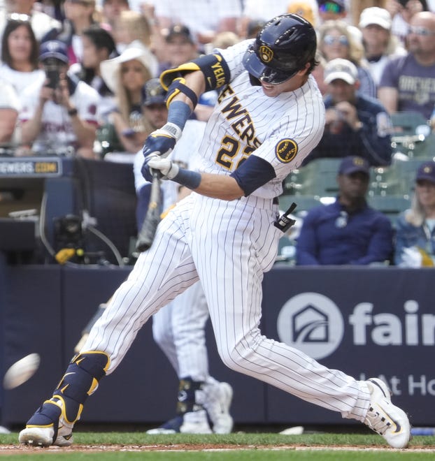 Milwaukee Brewers left fielder Christian Yelich (22) hits the ball during the bottom of the first inning against San Francisco Giants Saturday, May 27, 2023, at American Family Field in Milwaukee. Ebony Cox / Milwaukee Journal Sentinel