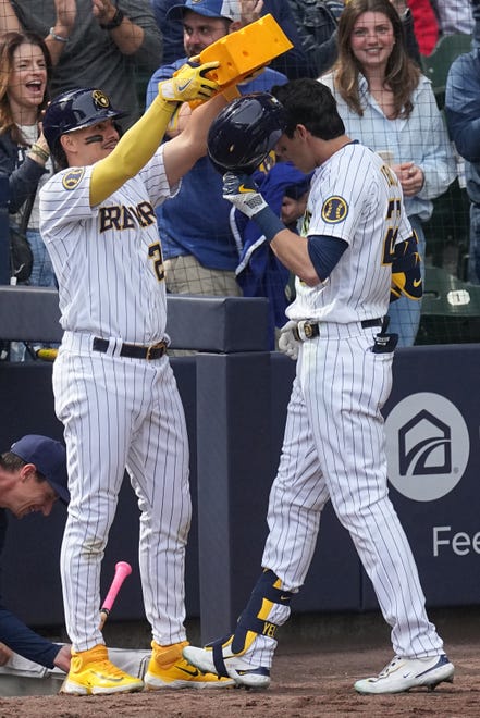 Milwaukee Brewers left fielder Christian Yelich (22) celebrates his solo home run with shortstop Willy Adames (27) during the seventh inning of their game against the St. Louis Cardinals Sunday, April 9, 2023 at American Family Field in Milwaukee, Wis.



Mark Hoffman/Milwaukee Journal Sentinel