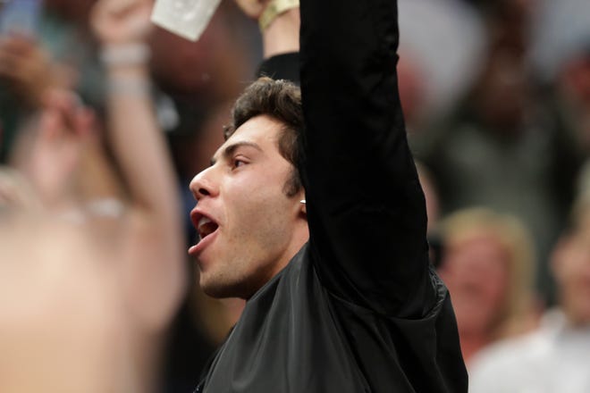 Milwaukee Brewers outfielder Christian Yelich basks in the cheers of fans after chugging a beer during the second half of their NBA Eastern Conference finals game Thursday, May 23, 2019 at Fiserv Forum in Milwaukee, Wis. The. Toronto Raptors beat the Milwaukee Bucks 105-99.



MARK HOFFMAN/MILWAUKEE JOURNAL SENTINEL