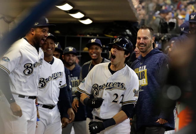 Milwaukee Brewers right fielder Christian Yelich (22) celebrates his home run in the 1st inning. The Brewers play the Los Angeles Dodgers in Game 7 of the National League Championship Series baseball game Saturday, October 20, 2018 at Miller Park in Milwaukee, Wis. 

RICK WOOD/MILWAUKEE JOURNAL SENTINEL