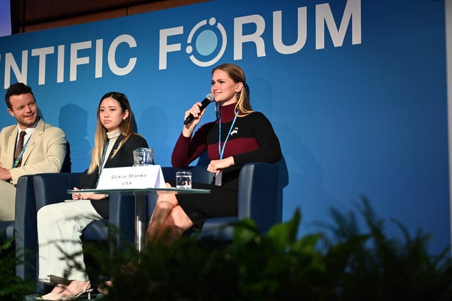 Grace Stanke speaks on a panel at a scientific forum as Miss America.