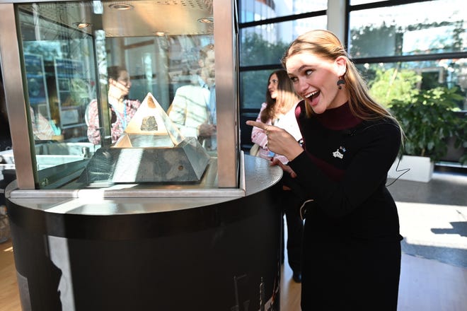 Grace Stanke poses with a space rock.