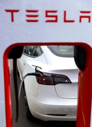 Teslas charge at an electric vehicle charging station at a Target, Tuesday, April 11, 2023, in Salem, Ore.