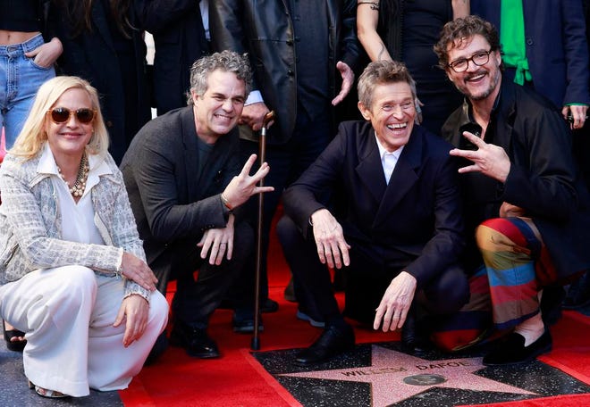 Actress Patricia Arquette (left), actor Mark Ruffalo (second from left) and actor Pedro Pascal (right) pose with actor Willem Dafoe during the ceremony honoring him with a Hollywood Walk of Fame star in Hollywood, California, on Jan. 8, 2024.