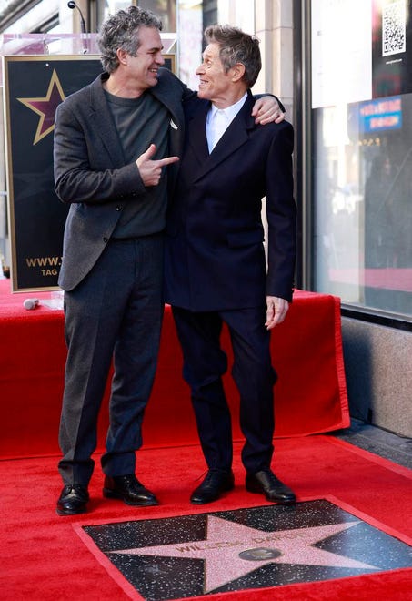 Actor Mark Ruffalo (left) poses with actor Willem Dafoe during the ceremony honoring Dafoe with a Hollywood Walk of Fame star in Hollywood, California, on Jan. 8, 2024.