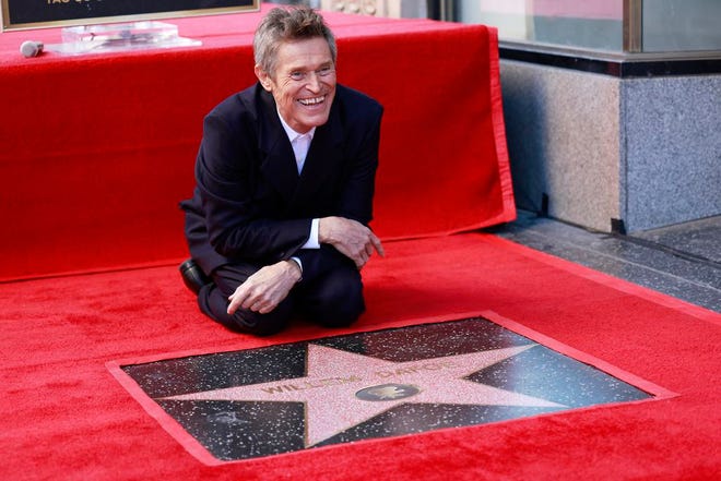 Actor Willem Dafoe poses with his newly unveiled Hollywood Walk of Fame star in Hollywood, California, on Jan. 8, 2024.