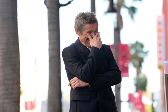 Willem Dafoe laughs at a ceremony honoring him with a star on the Hollywood Walk of Fame, Monday, Jan. 8, 2024, in Los Angeles.