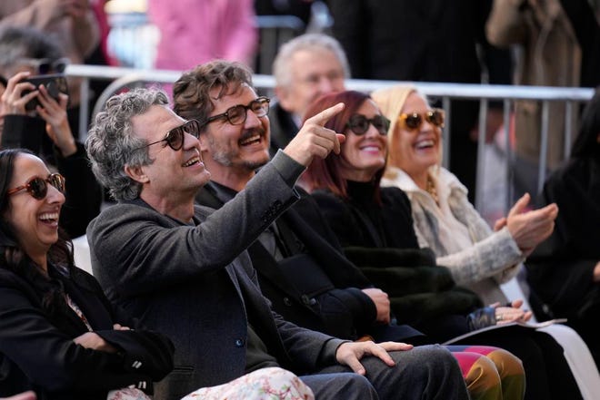 Mark Ruffalo, second from left, jokes with Pedro Pascal, center, as they attend a ceremony honoring Willem Dafoe with a star on the Hollywood Walk of Fame, Monday, Jan. 8, 2024, in Los Angeles.