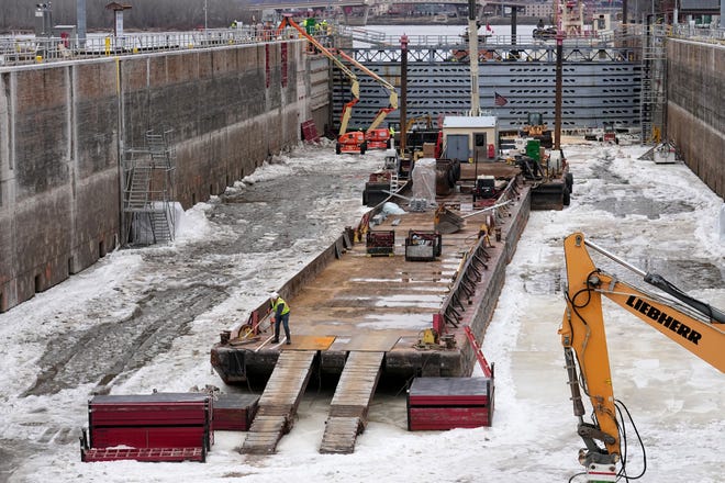 A barge sits on the bottom of the chamber at Lock and Dam No. 2 Tuesday, January 30, 2024 on the Mississippi River in Hastings, Minnesota. Late last year, the U.S. Army Corps of Engineers, St. Paul District dewatered the lock chamber for routine inspection, maintenance and repairs. Locks are dewatered on a 20-year cycle. The dewatering is accomplished by placing large bulkheads at the upstream and downstream ends of the lock chamber to prevent the flow of water into the chamber. The lock will reopen for shipping on March 5.

Mark Hoffman/Milwaukee Journal Sentinel