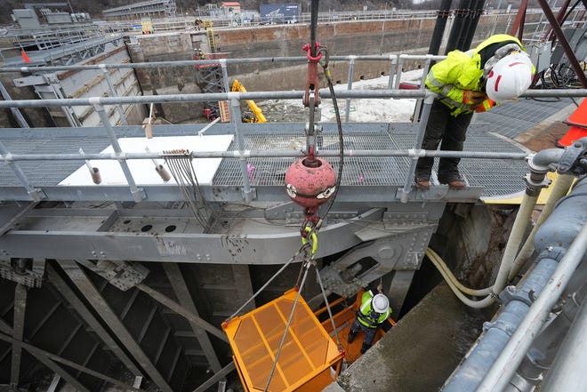 A worker performs maintenance on the upstream gates at Lock and Dam No. 2 Tuesday, January 30, 2024 on the Mississippi River in Hastings, Minnesota. Late last year, the U.S. Army Corps of Engineers, St. Paul District dewatered the lock chamber for routine inspection, maintenance and repairs. Locks are dewatered on a 20-year cycle. The dewatering is accomplished by placing large bulkheads at the upstream and downstream ends of the lock chamber to prevent the flow of water into the chamber. The lock will reopen for shipping on March 5.

Mark Hoffman/Milwaukee Journal Sentinel