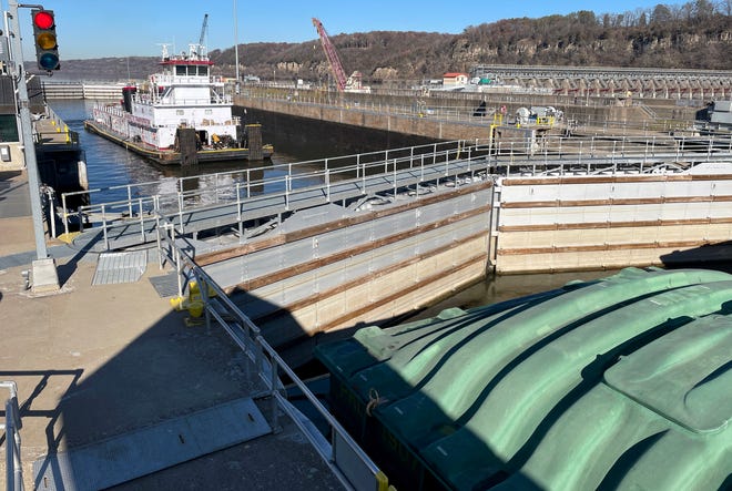 The Marquette Transportation towboat Angela K travels downstream through Lock and Dam No. 2 Wednesday, November 15, 2023 on the Mississippi River in Hastings, Minnesota. After It was constructed in 1930 by the, the walls settled and tilted which led to construction of a second lock completed in 1948.