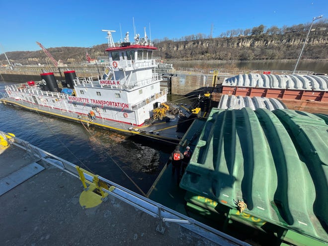 The Marquette Transportation towboat Angela K travels downstream through Lock and Dam No. 2 Wednesday, November 15, 2023 on the Mississippi River in Hastings, Minnesota. After It was constructed in 1930 by the, the walls settled and tilted which led to construction of a second lock completed in 1948.