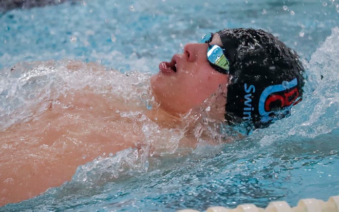 Door County United’s Jack Monfils backstrokes during the 200-yard IM at the 2024 EWC Championship Swim Meet, Saturday, February 3, 2024, in Kiel, Wis.