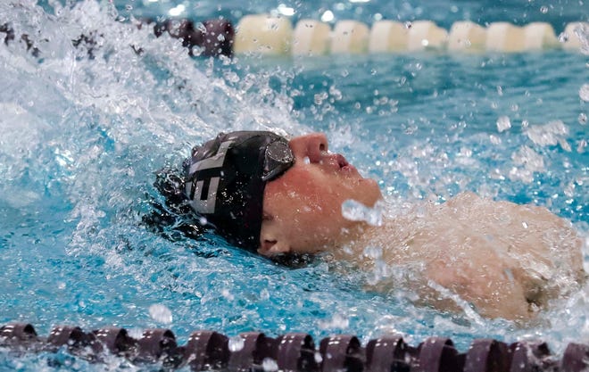 Kiel/Elkhart Lake-Glenbeulah’s Mason Fintelmann backstrokes the 200-yard IM at the 2024 EWC Championship Swim Meet, Saturday, February 3, 2024, in Kiel, Wis.