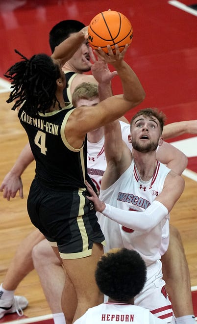Purdue forward Trey Kaufman-Renn shoots over Wisconsin forward Tyler Wahl (5) during the first half of their game Sunday, February 4, 2024 at the Kohl Center in Madison, Wisconsin.