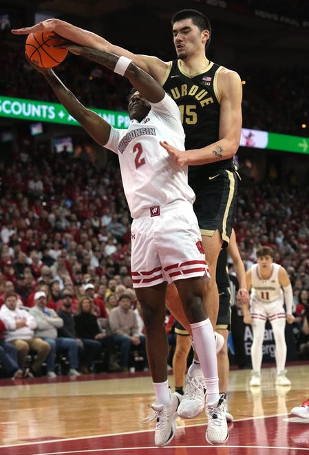 Purdue center Zach Edey (15) fouls Wisconsin guard AJ Storr (2) during the second half of their game Sunday, February 4, 2024 at the Kohl Center in Madison, Wisconsin. Purdue beat Wisconsin 75-69.