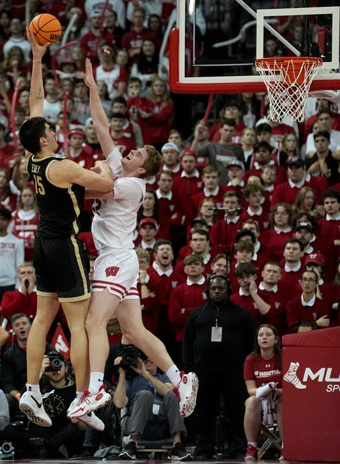 Purdue center Zach Edey (15) shoots over Wisconsin forward Steven Crowl during the second half of their game Sunday, February 4, 2024 at the Kohl Center in Madison, Wisconsin. Purdue beat Wisconsin 75-69.