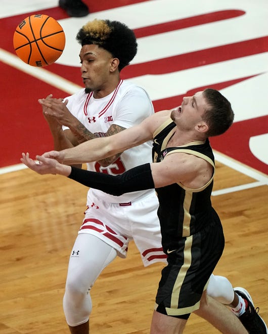 Wisconsin guard Chucky Hepburn (23) swats the ball from the hands of Purdue guard Braden Smith (3) during the first half of their game Sunday, February 4, 2024 at the Kohl Center in Madison, Wisconsin.