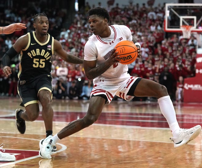 Wisconsin guard AJ Storr (2) makes a move on Purdue guard Lance Jones (55) during the second half of their game Sunday, February 4, 2024 at the Kohl Center in Madison, Wisconsin. Purdue beat Wisconsin 75-69.