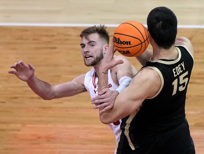 Purdue center Zach Edey (15) out rebounds Wisconsin forward Tyler Wahl (5) during the first half of their game Sunday, February 4, 2024 at the Kohl Center in Madison, Wisconsin.