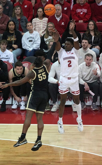 Wisconsin guard AJ Storr (2) misses a three-point shot over Purdue’s Lance Jones (55) during the first half of their game Sunday, February 4, 2024 at the Kohl Center in Madison, Wisconsin.