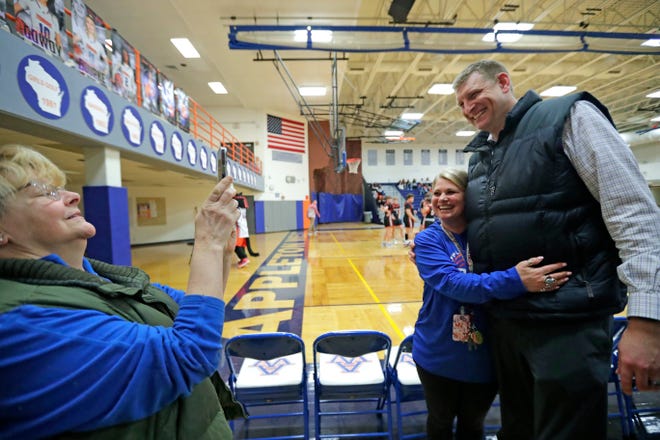 Appleton West great Brian Butch poses for pictures with his former teachers Lynn Schadrie, left, and Kirsten Schubbe Friday, February 2, 2024, in Appleton, Wisconsin. Butch had his No. 42 jersey retired by the school prior to Friday's game against Kaukauna. Butch was a two-time Associated Press state player of the year, the 2003 Wisconsin Mr. Basketball winner and a McDonald's All-American during his final season with the Terrors.