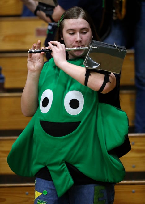 Freedom High School band member Natalee Springstroh plays the piccolo during their boys basketball game against Little Chute High School Thursday, February 1, 2024, in Freedom, Wisconsin. Freedom won 54-47.