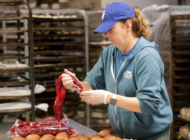 Owner Dawn Ebert fills and coats paczki at Simple Simon bakery on Thursday, February 1, 2024 in Appleton, Wis.
Wm. Glasheen USA TODAY NETWORK-Wisconsin