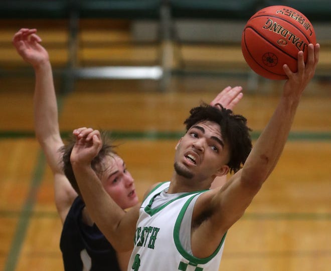 Oshkosh North High School's Xzayvion Mitchell (2) against Appleton North High School's Will Sweeney (1) during their boys basketball game on Tuesday, January 30, 2024 in Oshkosh, Wis. Oshkosh North defeated Appleton North 83-69.
Wm. Glasheen USA TODAY NETWORK-Wisconsin