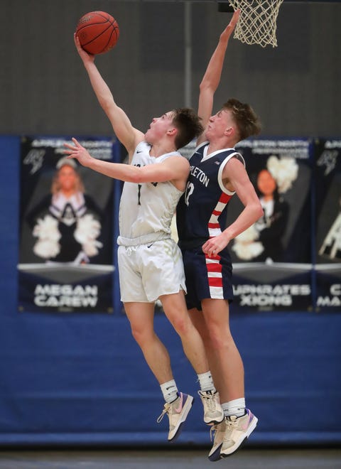 Appleton North High School's Will Sweeney (1) against Appleton East High School's Jacob Weisbach (12) during their boys basketball game on Tuesday, February 6, 2024 at Appleton North High School in Appleton, Wis. East defeated North 58-44.
Wm. Glasheen USA TODAY NETWORK-Wisconsin