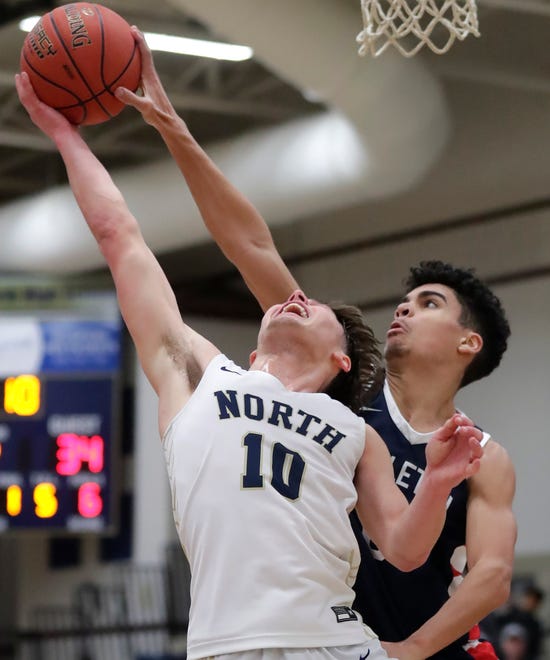 Appleton North High School's Sean Hansen (10) against Appleton East High School's Grayson Kasmarek (0) during their boys basketball game on Tuesday, February 6, 2024 at Appleton North High School in Appleton, Wis. East defeated North 58-44.
Wm. Glasheen USA TODAY NETWORK-Wisconsin