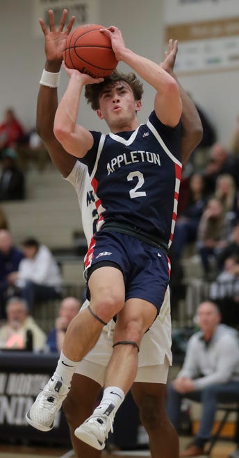 Appleton East High School's Joey LaChapell (2) against Appleton North High School's Abraham Tomori (23) during their boys basketball game on Tuesday, February 6, 2024 at Appleton North High School in Appleton, Wis. East defeated North 58-44.
Wm. Glasheen USA TODAY NETWORK-Wisconsin