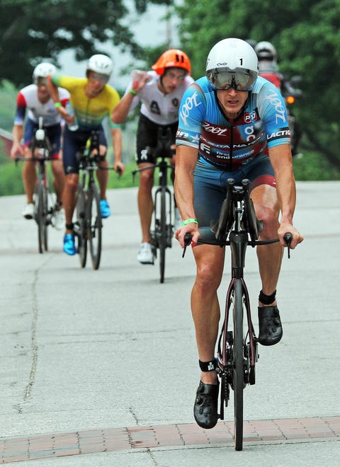 Matthew Hanson of the United States, a Buena Vista University graduate, leads during the Ironman North American Championship 140.6-mile Des Moines Triathlon as athletes compete in a 2.4-mile swim at Gray’s Lake, 112-mile bike race, and a 26.2-mile run in the Des Moines metro on Sunday, June 12, 2022. This regional competition offered qualifying slots to the 2022 Ironman World Championship in Kailua-Kona, Hawaii, in early October 2022.