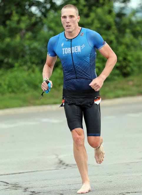 A competitor heads to the transition area during the Ironman North American Championship 140.6-mile Des Moines Triathlon as athletes compete in a 2.4-mile swim at Gray’s Lake, 112-mile bike race, and a 26.2-mile run in Des Moines on Sunday, June 12, 2022. This regional competition will offer qualifying slots to the 2022 Ironman World Championship in Kailua-Kona, Hawaii in early October 2022.