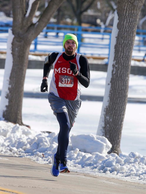 Robert Coehoorn, of Brandon, Wis., was the first finisher in the 5K Run/Walk & Kids Fun Run at Lakeside Park, Saturday, February 11, 2023, in Fond du Lac, Wis.