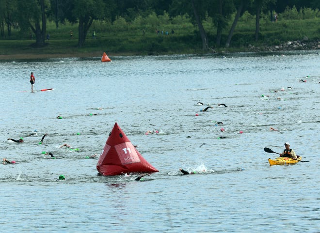 Competitors swim during the Ironman North American Championship 140.6-mile Des Moines Triathlon as athletes compete in a 2.4-mile swim at Gray’s Lake, 112-mile bike race, and a 26.2-mile run in Des Moines on Sunday, June 12, 2022. This regional competition will offer qualifying slots to the 2022 Ironman World Championship in Kailua-Kona, Hawaii in early October 2022.