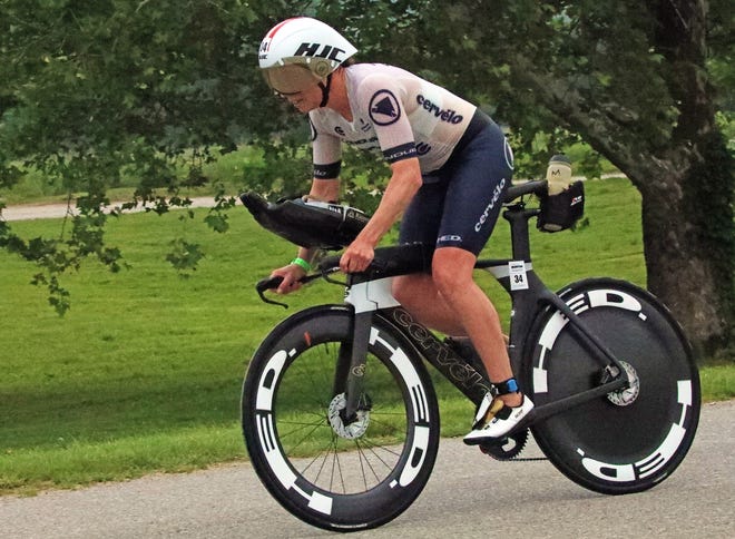 Susie Cheetham of the United Kingdom rides through Water Works Park during the Ironman North American Championship 140.6-mile Des Moines Triathlon as athletes compete in a 2.4-mile swim at Gray’s Lake, 112-mile bike race, and a 26.2-mile run in Des Moines on Sunday, June 12, 2022. This regional competition will offer qualifying slots to the 2022 Ironman World Championship in Kailua-Kona, Hawaii in early October 2022.