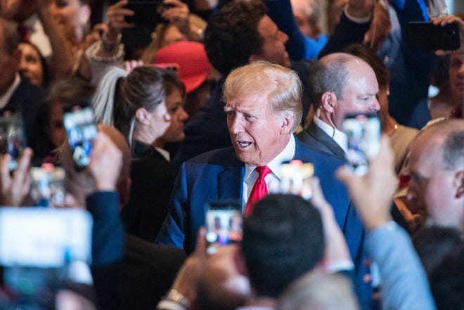 Former President Donald Trump greets supporters as he arrives to a press event at Mar-A-Lago on Tuesday, April 4, 2023, in Palm Beach FL. Former President Trump returned to Mar-A-Lago Tuesday evening after facing arraignment in New York earlier in the day.