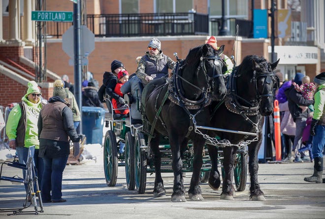 Breezy Hill Campground horse-drawn carriages gave rides in downtown during the Sturgeon Spectacular, Saturday, February 11, 2023, in Fond du Lac, Wis.