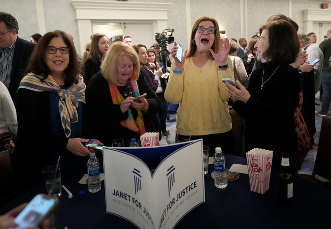 Chris Gould (second right), of Mequon, a friend of Janet Protasiewicz, reacts the race being called in Protasiewicz’s favor during Supreme Court candidate Janet Protasiewicz election night watch party for state Supreme Court at Saint Kate - The Arts Hotel in Milwaukee  on Tuesday, April 4, 2023. Wisconsin voters headed to the polls for the spring general election to determine a new justice on the Supreme Court as well as other local, nonpartisan offices. Protasiewicz is facing off against Daniel Kelly for a spot on Wisconsin's top court.