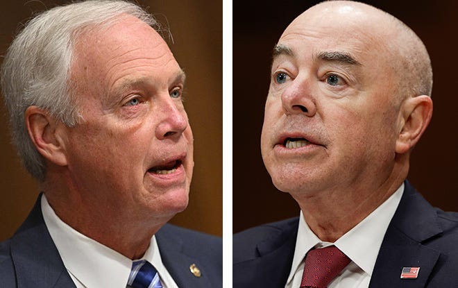 U.S. Sen. Ron Johnson, R-Wis., left, and Homeland Security Secretary Alejandro Mayorkas